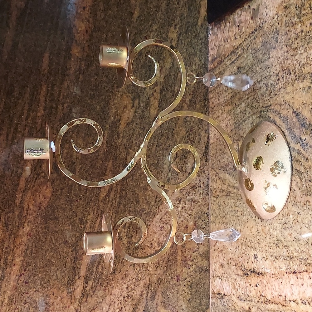 Gold taper candle holder with clear crystals.Apex